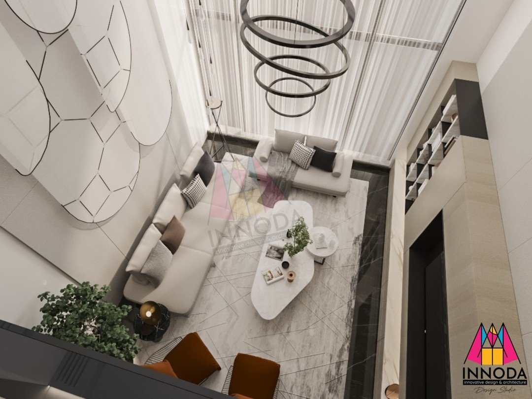 Overhead perspective of high-ceiling living atrium